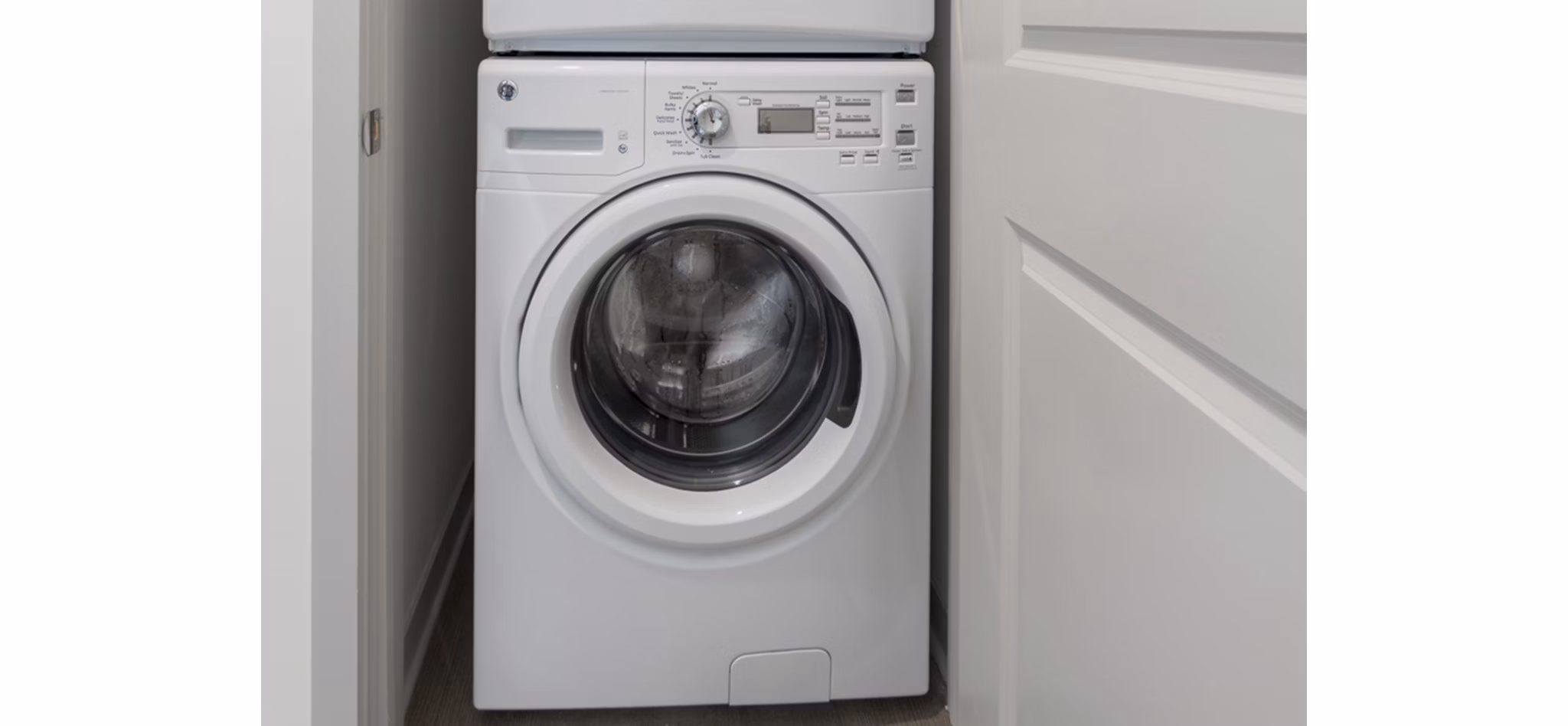 Laundry room featuring advanced washers and dryers at Main & Clay Apartments