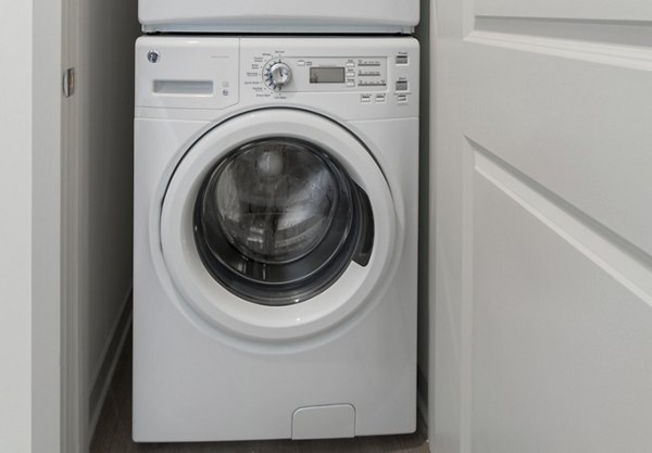 Laundry room featuring advanced washers and dryers at Main & Clay Apartments