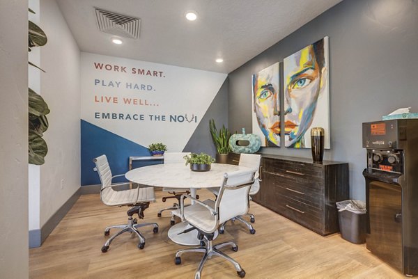 Vibrant clubhouse with modern seating at Novi at Jordan Valley Station Apartments