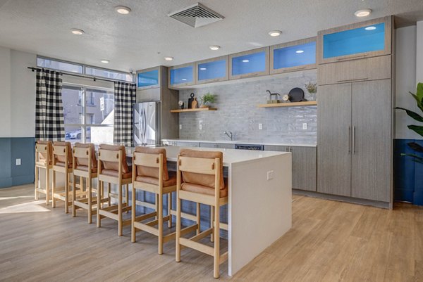 Clubhouse featuring modern design and seating areas at Novi at Jordan Valley Station Apartments