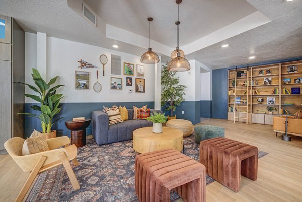 Clubhouse featuring modern decor and entertainment spaces at Novi at Jordan Valley Station Apartments