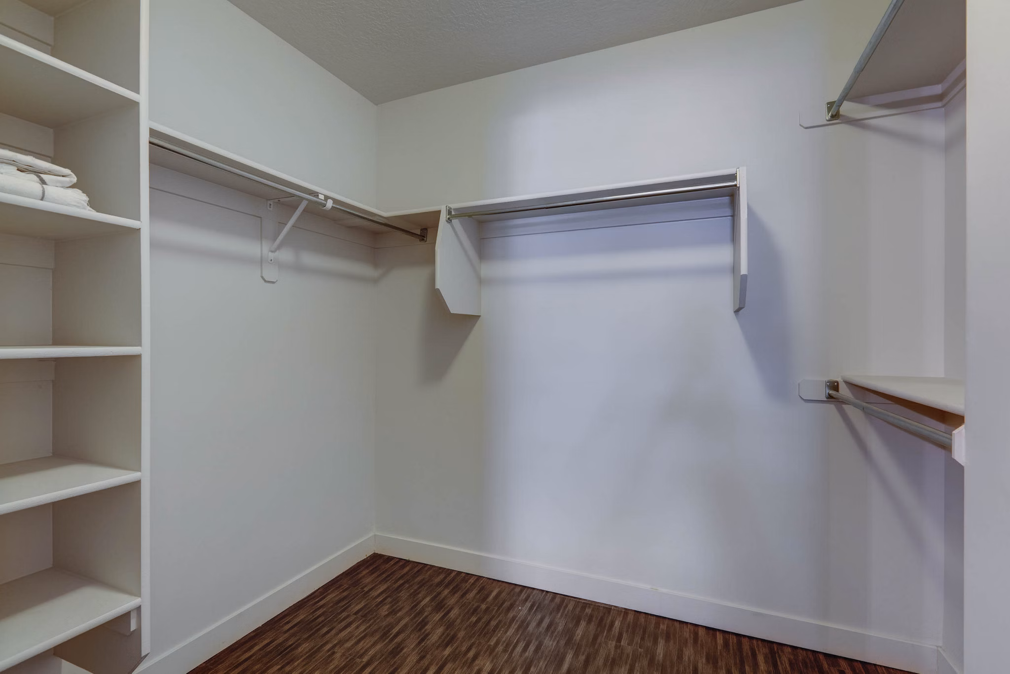 Walk-in closet with ample storage space in Novi at Jordan Valley Station Apartments