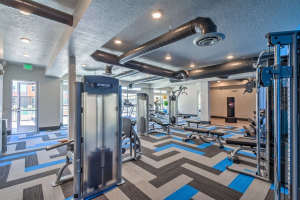 State-of-the-art fitness center with modern equipment at Novi at Jordan Valley Station Apartments