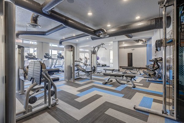 State-of-the-art fitness center with modern equipment at Novi at Jordan Valley Station Apartments