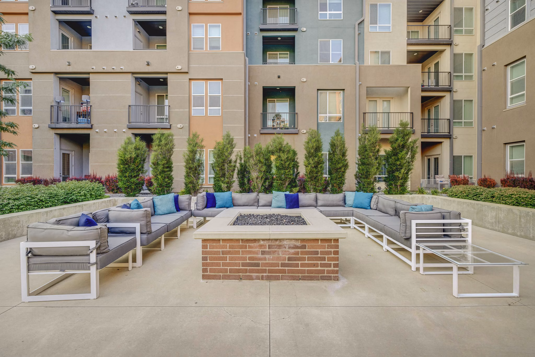Cozy outdoor fire pit at Novi at Jordan Valley Station Apartments, perfect for evening gatherings and relaxation