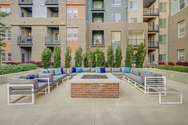 Cozy outdoor fire pit at Novi at Jordan Valley Station Apartments, perfect for evening gatherings and relaxation