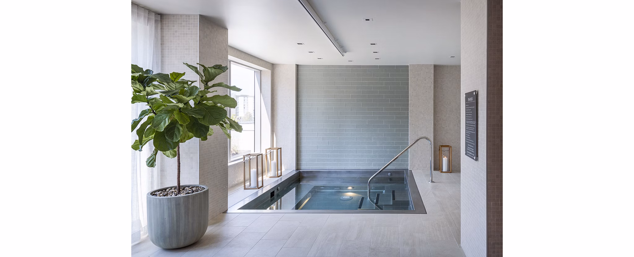 Resort-style pool at McKenzie Apartments offering luxury relaxation and city views for residents