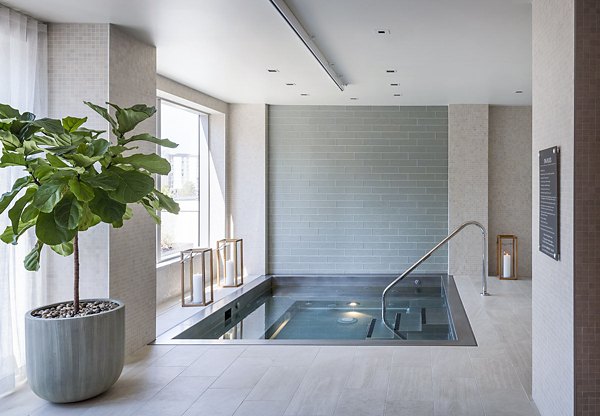 Resort-style pool at McKenzie Apartments offering luxury relaxation and city views for residents