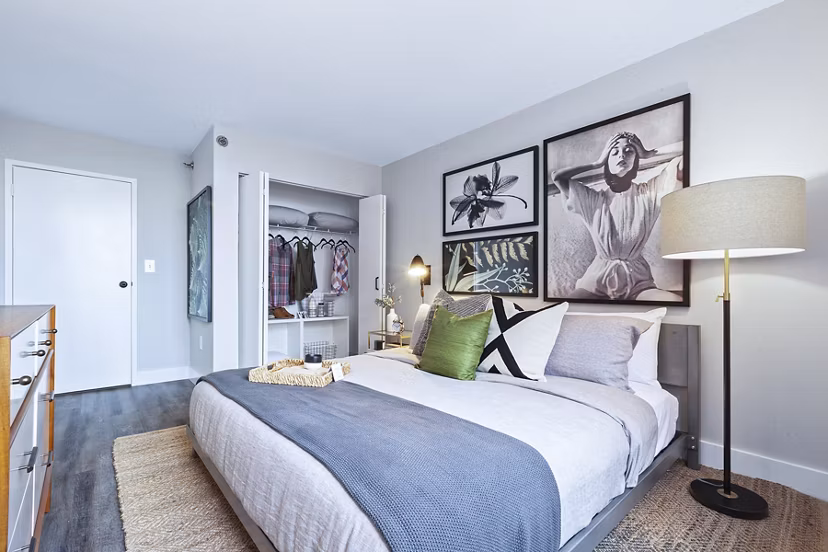 Bedroom featuring modern decor and large windows at Observer Park Apartments, luxury unit under Greystar management in Hoboken, NJ