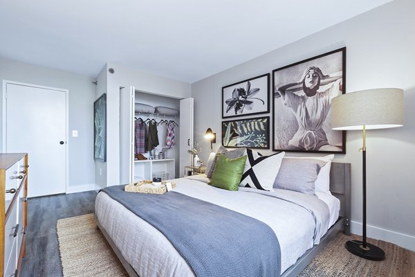 Bedroom featuring modern decor and large windows at Observer Park Apartments, luxury unit under Greystar management in Hoboken, NJ