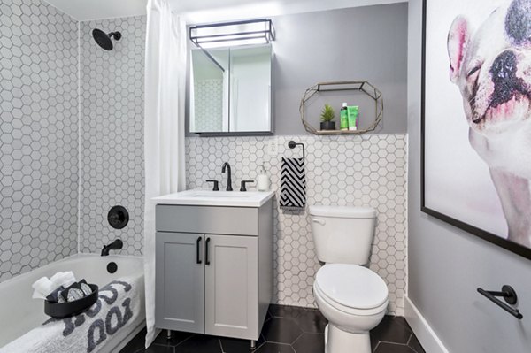 Observer Park Apartments: Modern bathroom with sleek fixtures and ample storage