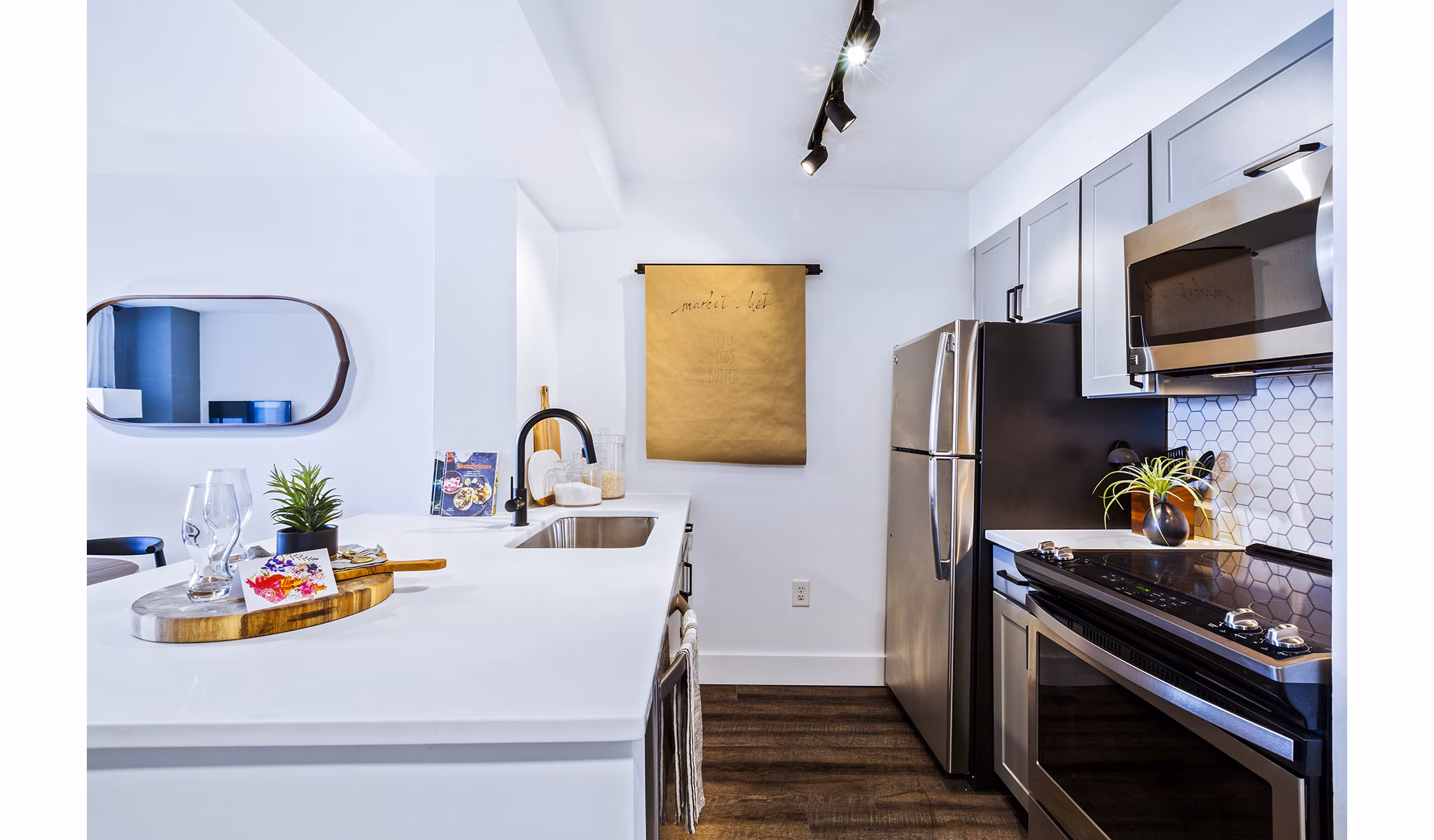 Modern kitchen with stainless steel appliances at Observer Park Apartments