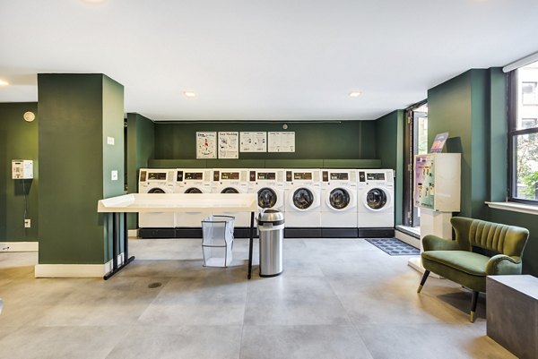 Modern laundry facility at Observer Park Apartments offering convenient washing and drying services for residents