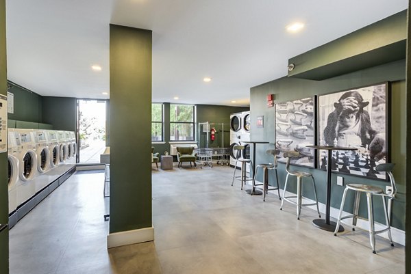 Modern laundry facility with energy-efficient machines at Observer Park Apartments