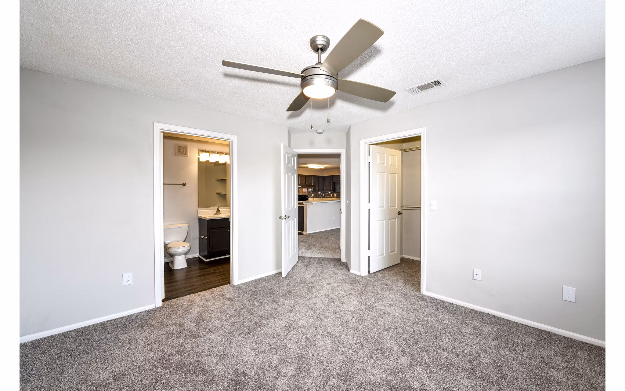 Cozy bedroom with modern furnishings at The Palmer Apartments