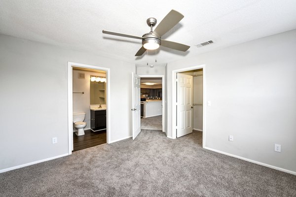 Cozy bedroom with modern furnishings at The Palmer Apartments