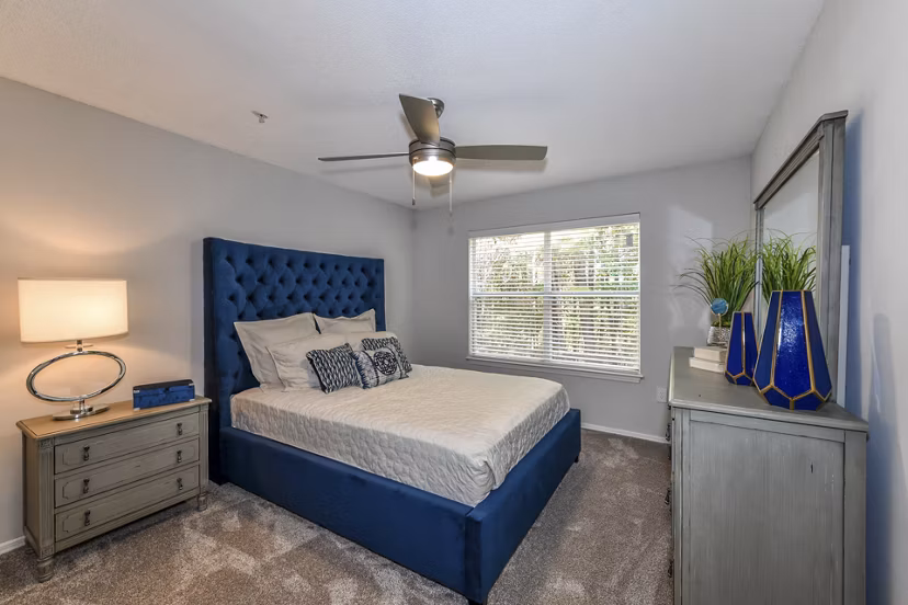 Cozy bedroom with modern decor at The Palmer Apartments