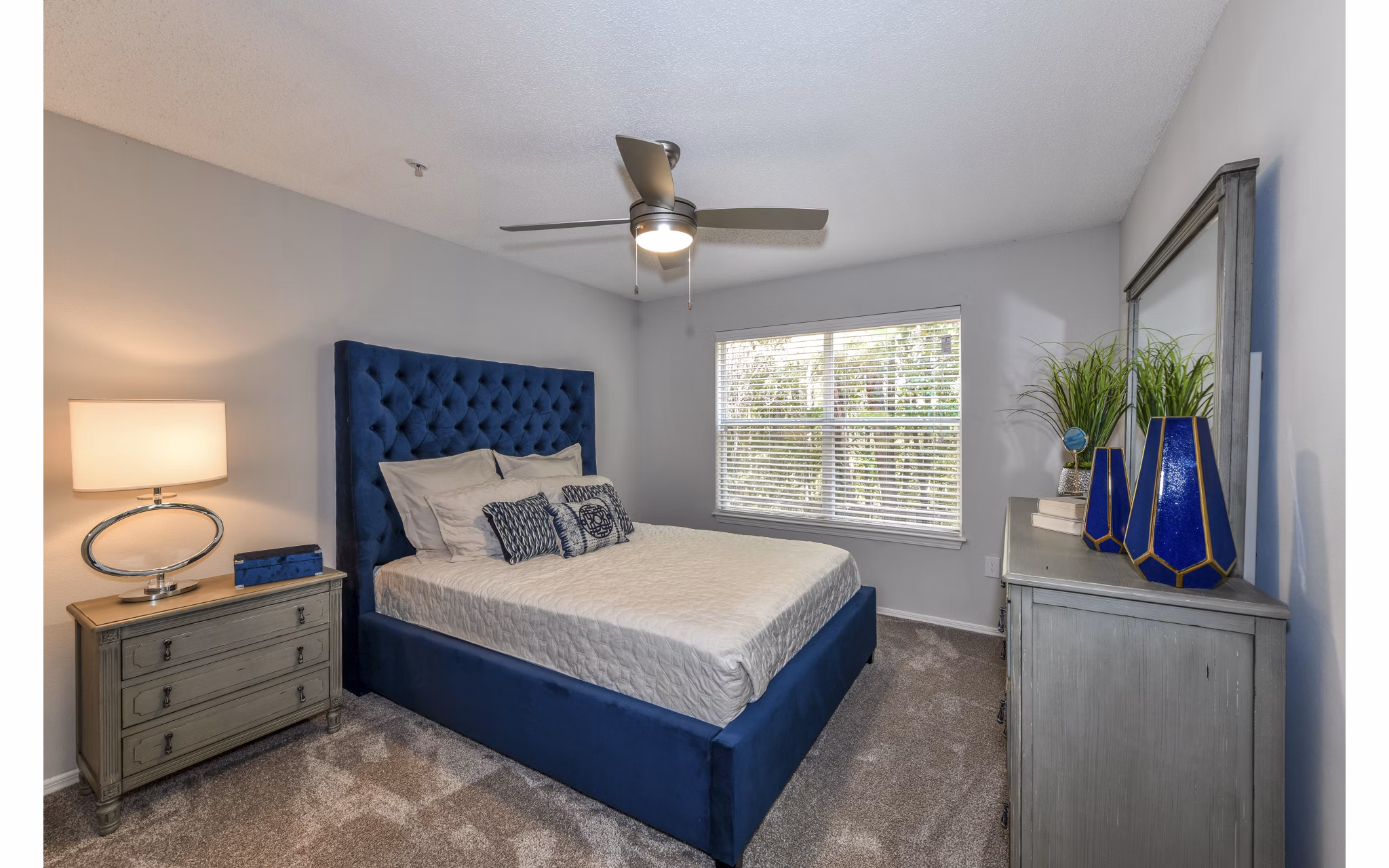 Cozy bedroom with modern decor at The Palmer Apartments