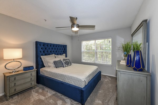 Cozy bedroom with modern decor at The Palmer Apartments