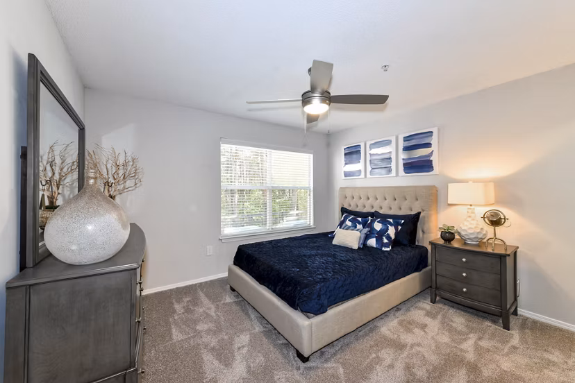 Cozy bedroom with stylish dÃ©cor at The Palmer Apartments, featuring a serene ambiance and modern furnishings