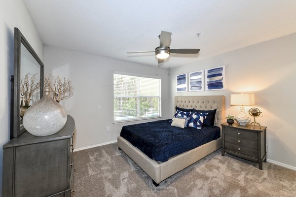 Cozy bedroom with stylish dÃ©cor at The Palmer Apartments, featuring a serene ambiance and modern furnishings
