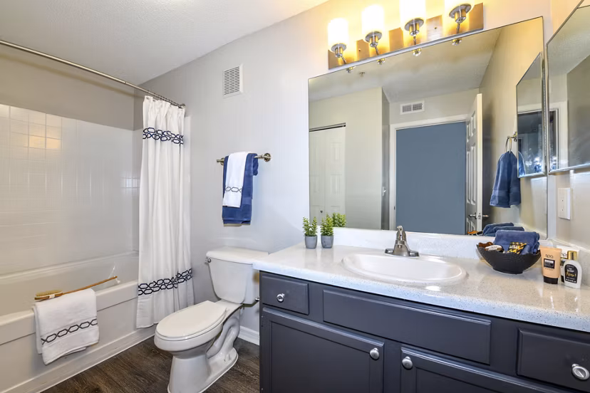 Modern bathroom with marble countertops and sleek fixtures at The Palmer Apartments, offering luxury living in the heart of the city