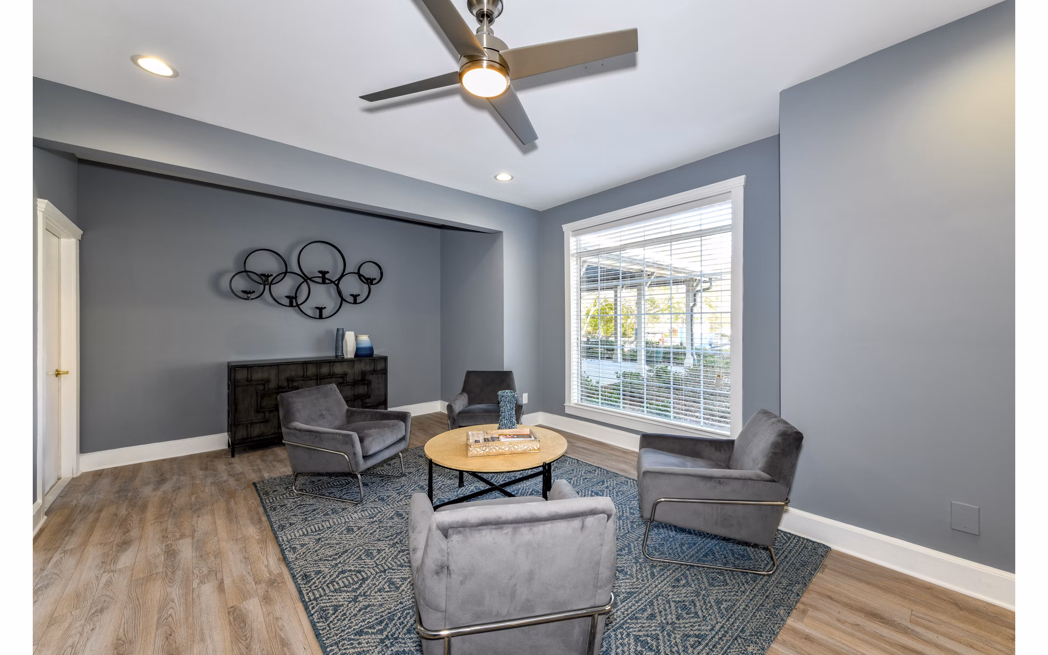 Modern clubhouse featuring sleek furnishings and social spaces at The Palmer Apartments, ideal for gatherings and community events