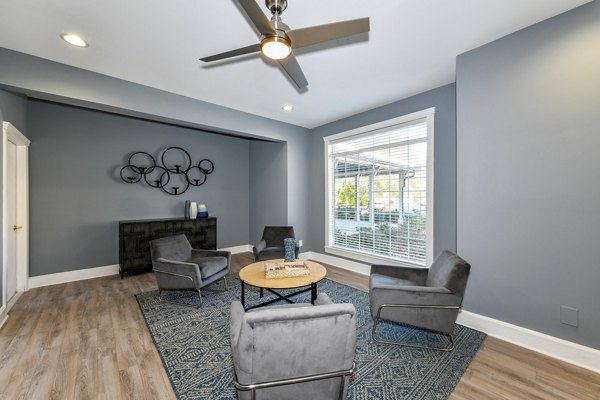 Modern clubhouse featuring sleek furnishings and social spaces at The Palmer Apartments, ideal for gatherings and community events