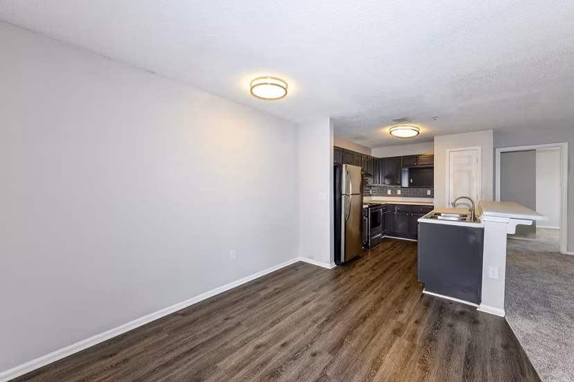 Modern dining area with elegant seating and lighting at The Palmer Apartments, showcasing luxury living spaces