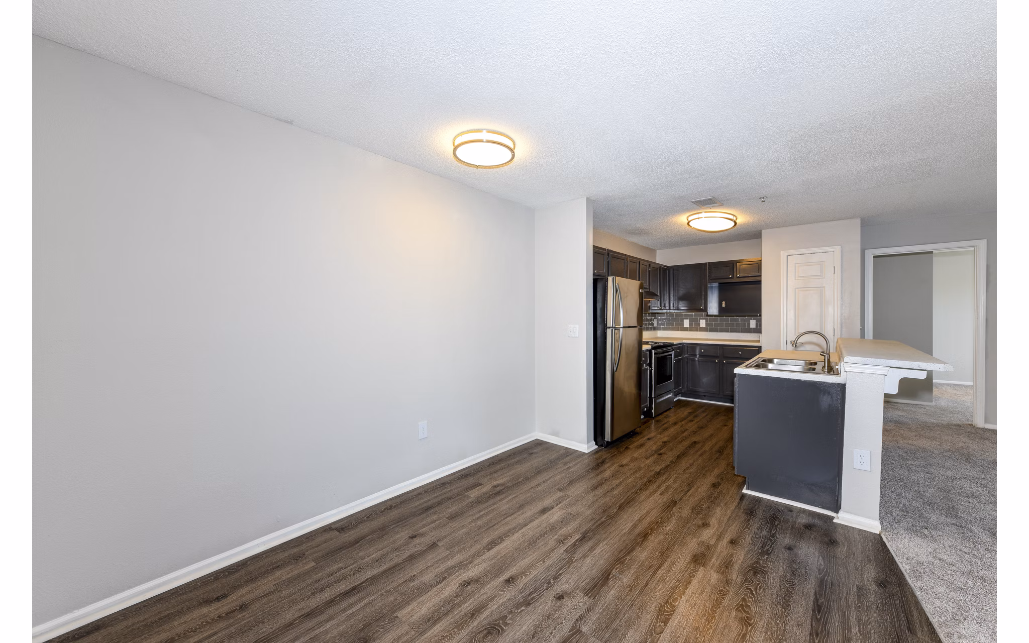 Modern dining area with elegant seating and lighting at The Palmer Apartments, showcasing luxury living spaces
