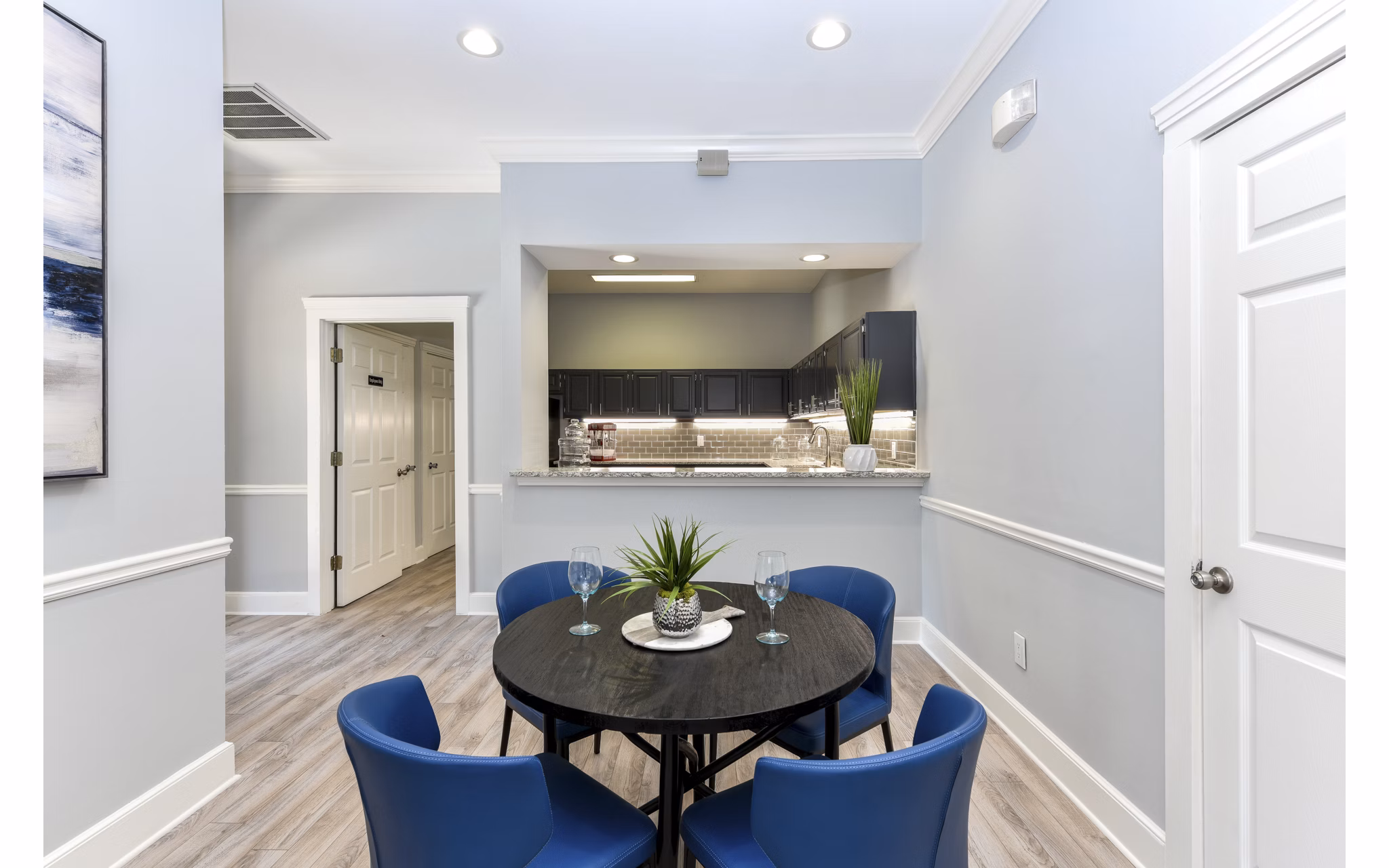 Dining area with modern furnishings and stylish lighting at The Palmer Apartments