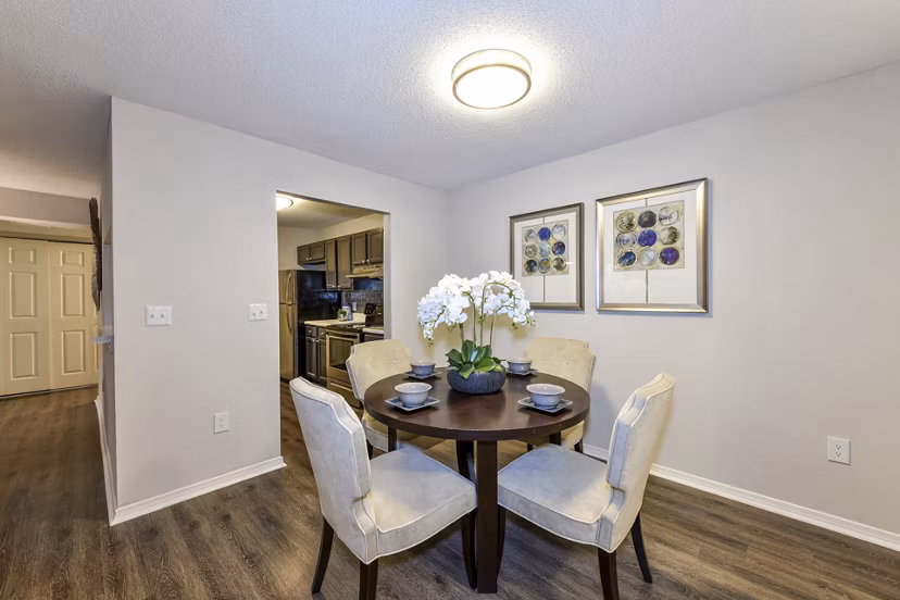 Dining area with modern furniture and warm lighting in The Palmer Apartments