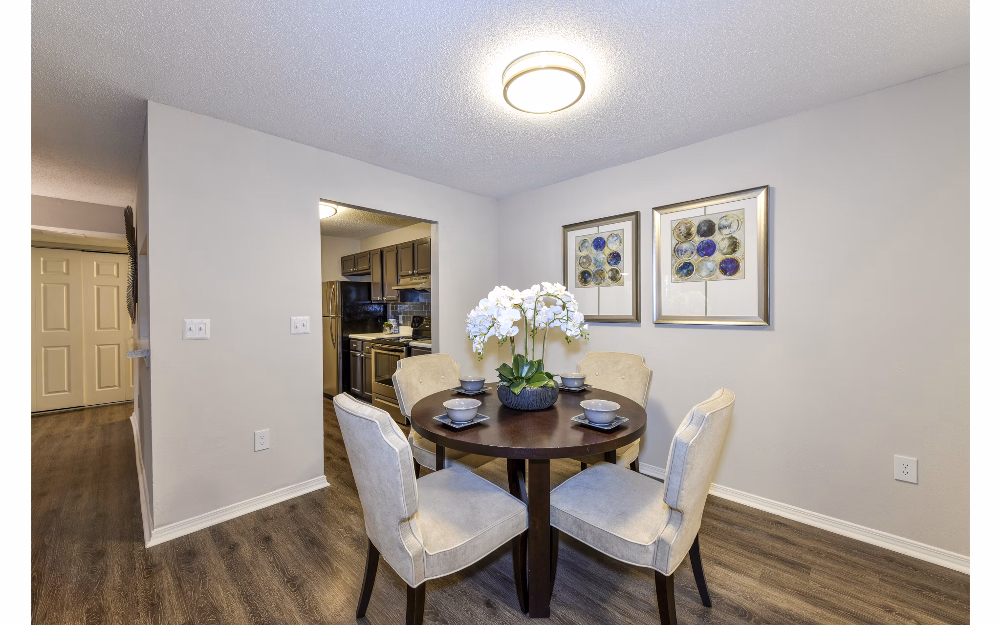 Dining area with modern furniture and warm lighting in The Palmer Apartments