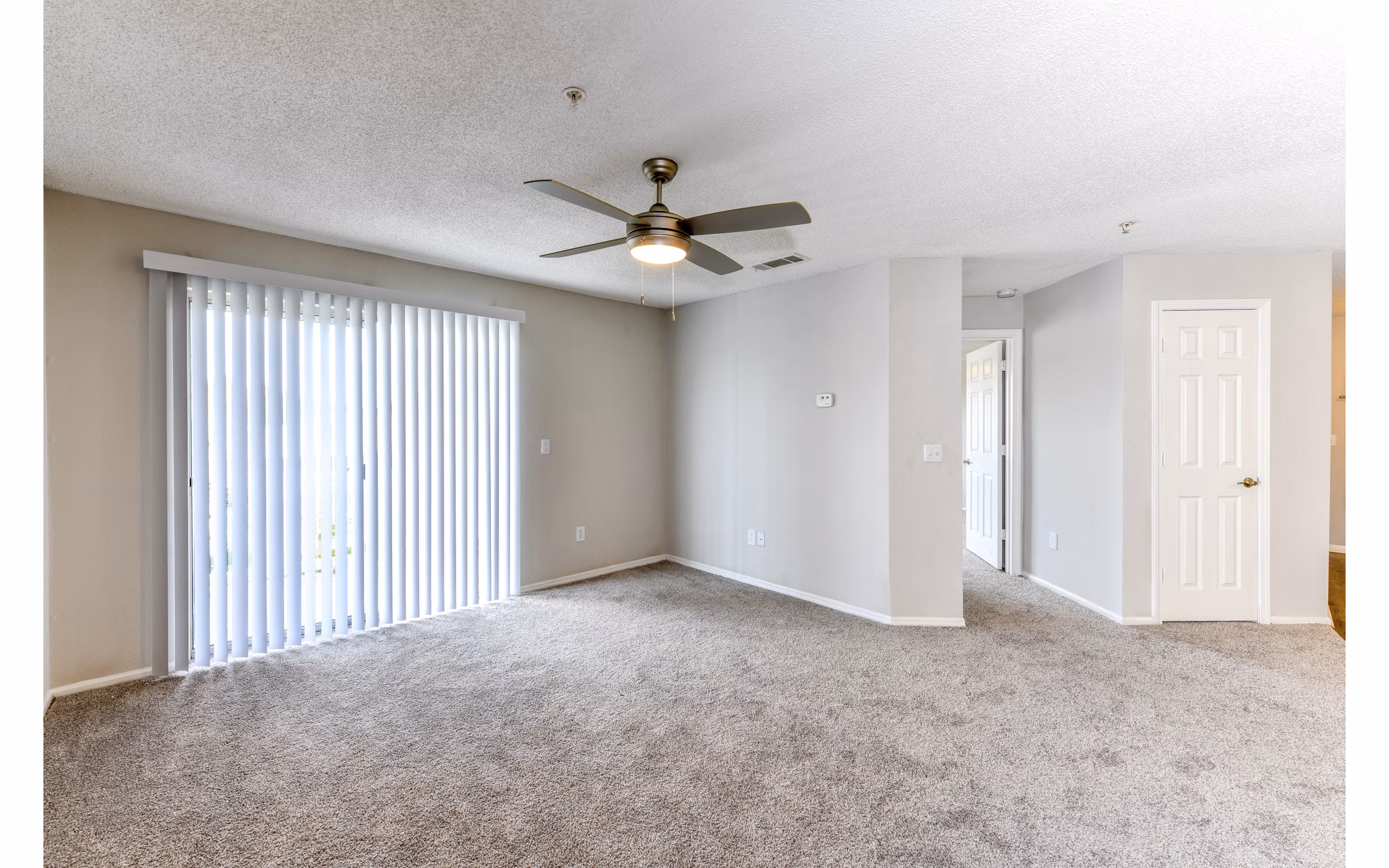 Spacious living room with modern decor at The Palmer Apartments in Greystar's luxury community