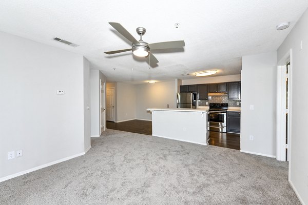 Modern living room with stylish furnishings and large windows at The Palmer Apartments, a premier luxury community