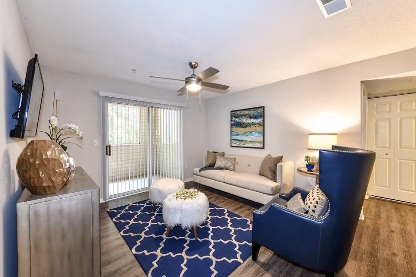 Cozy living room with modern furnishings at The Palmer Apartments