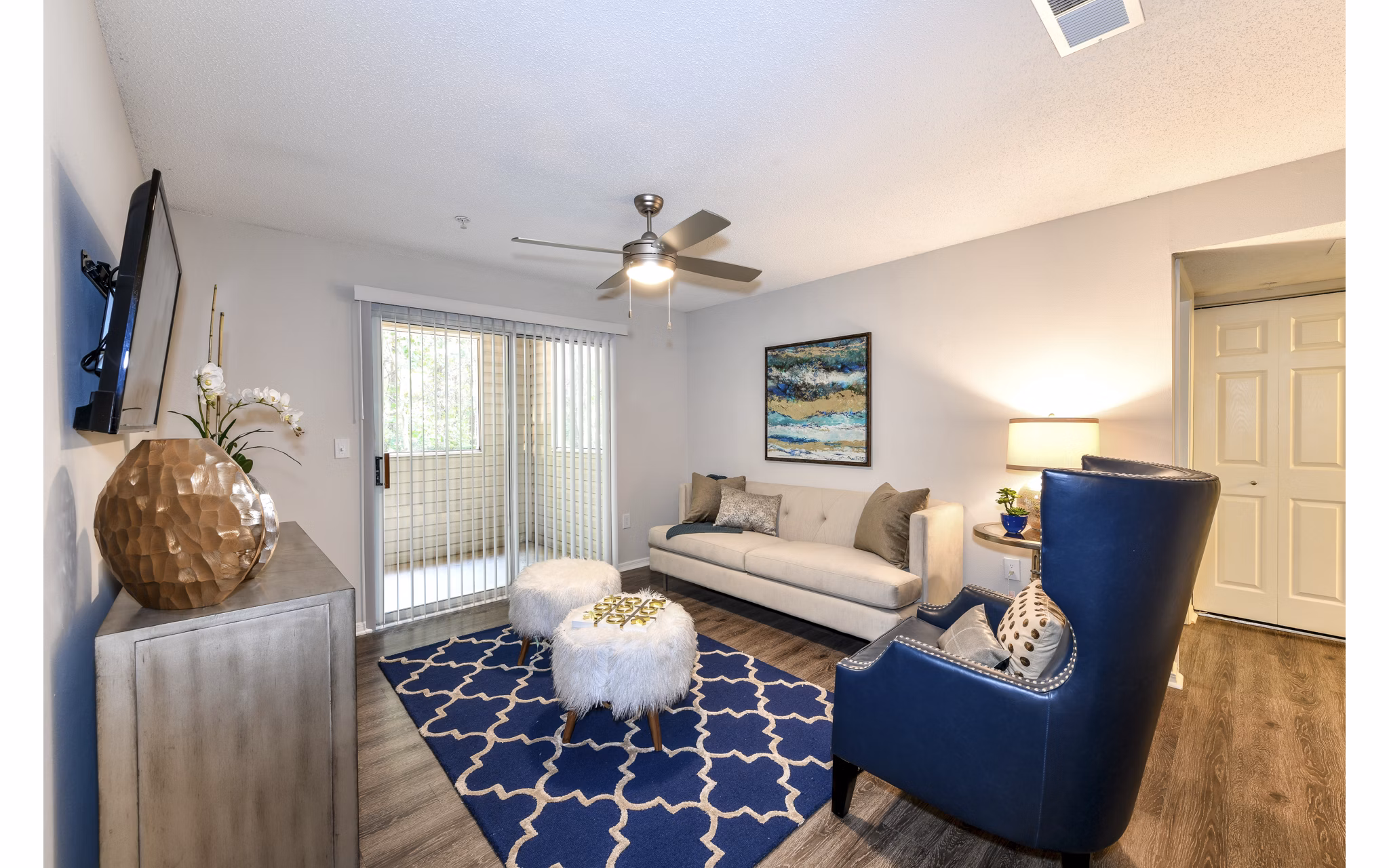 Cozy living room with modern furnishings at The Palmer Apartments