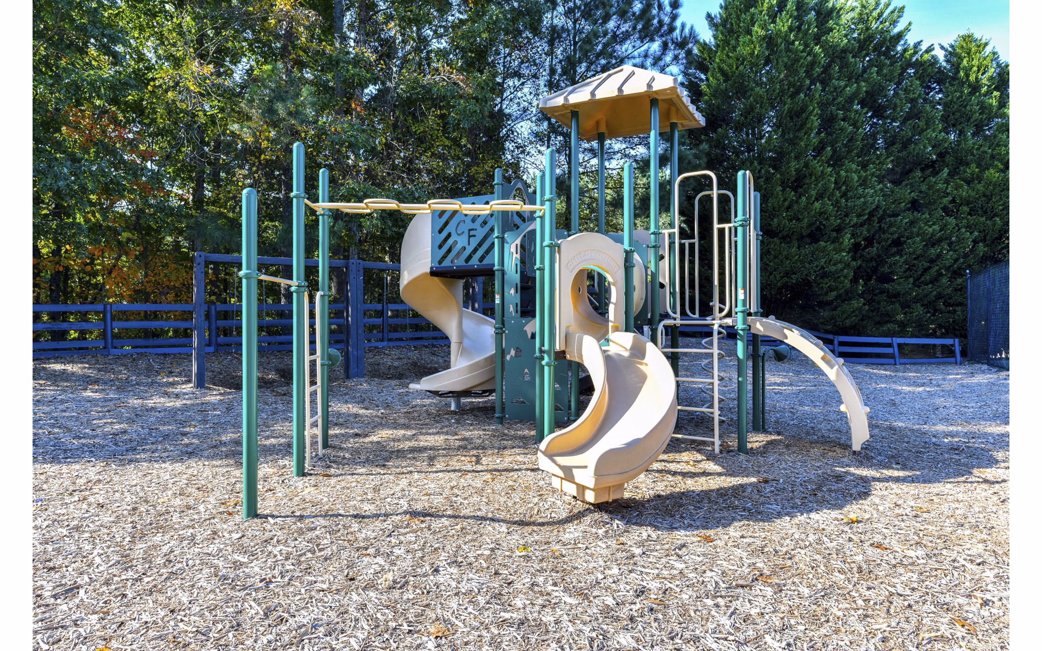 Outdoor playground featuring modern equipment at The Palmer Apartments