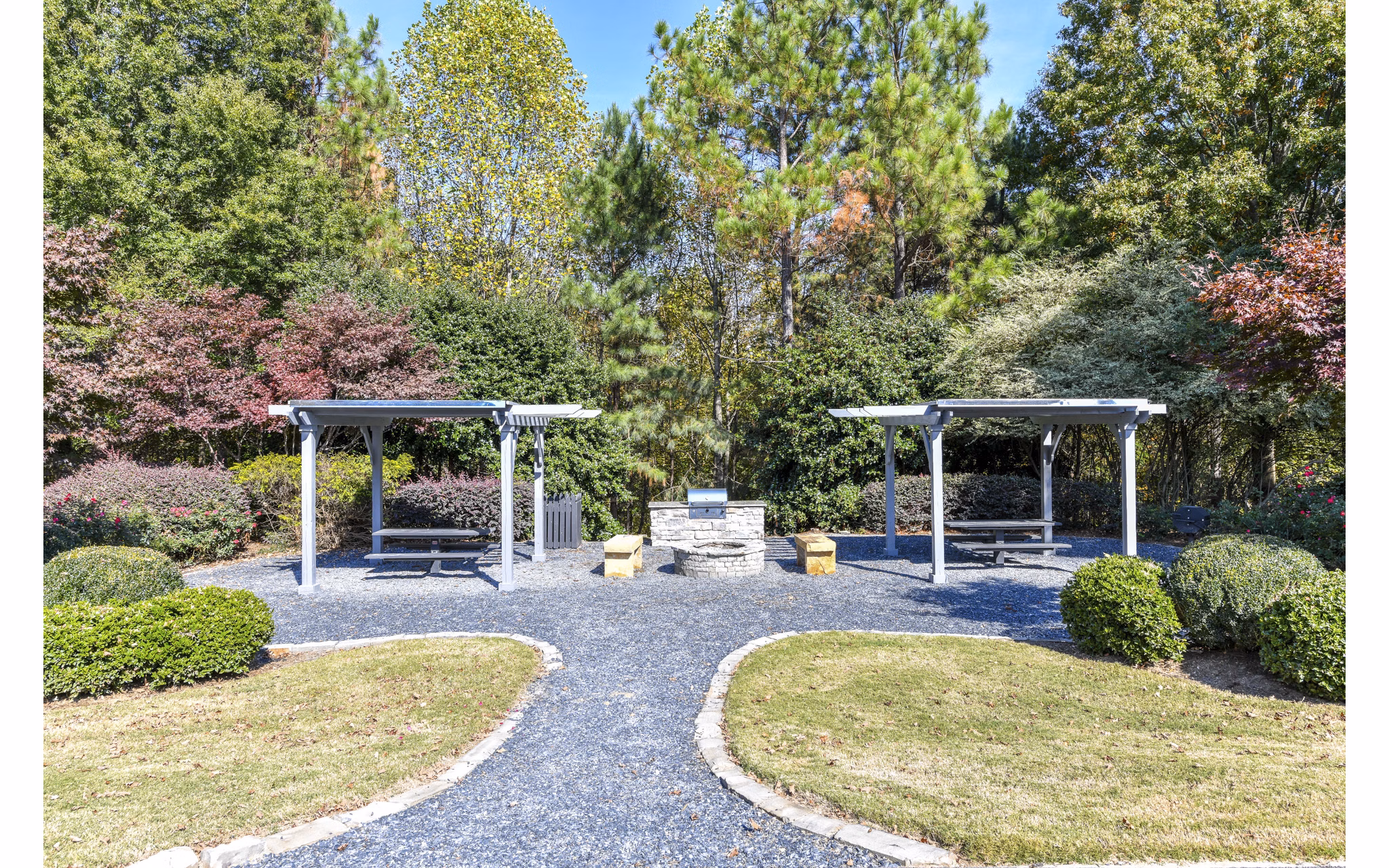 Outdoor grill area with modern seating at The Palmer Apartments, a luxurious community offering premium amenities located in a prime urban setting