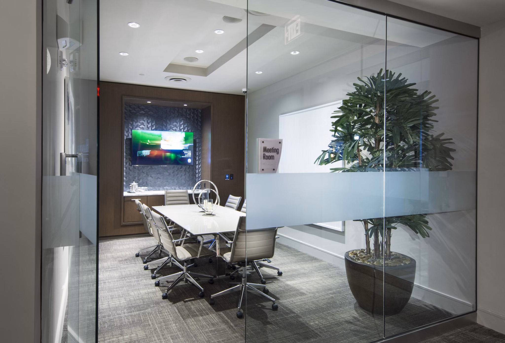 Meeting room equipped with modern technology and seating at Marq at the Pinehills Apartments, ideal for business gatherings and events