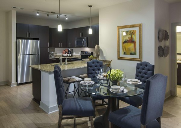Modern dining room with elegant lighting at Marq at the Pinehills Apartments