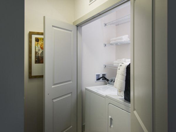 lLaundry room at Marq at the Pinehills Apartments
