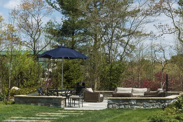 Courtyard with modern landscaping at Marq at the Pinehills Apartments