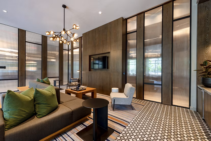 Modern living room with sofa, chairs, and decorative lighting in luxury apartments