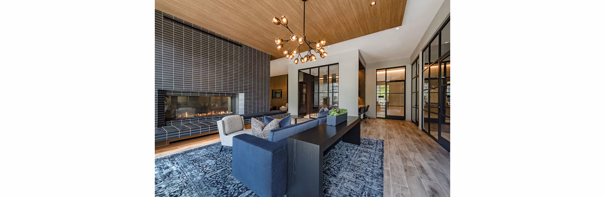 Luxurious resident lounge with seating and fireplace in GS Platform Building 3