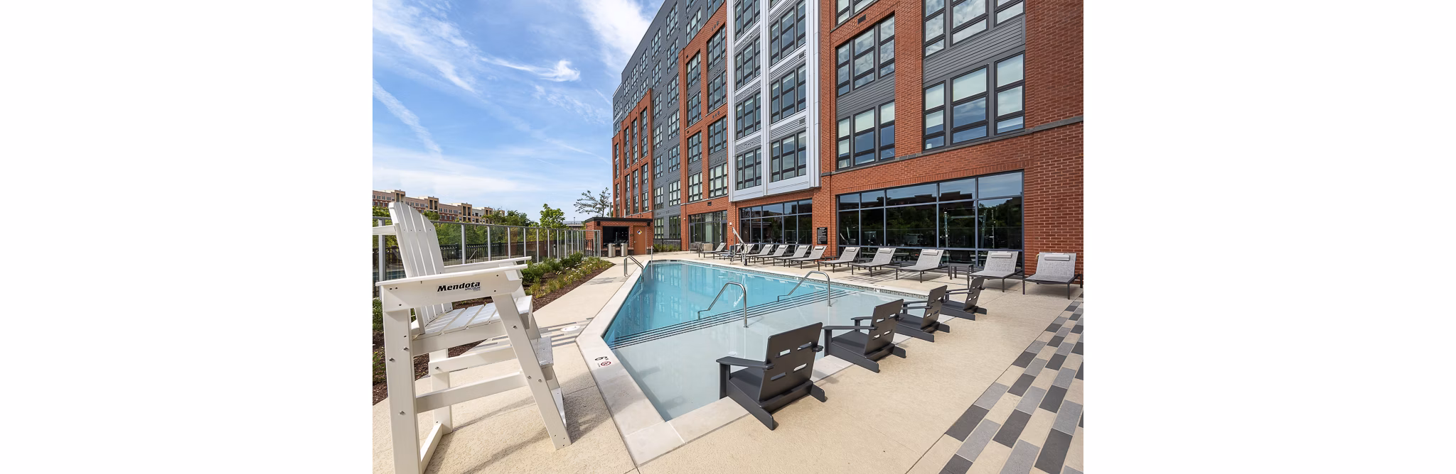 Outdoor seating and fire pit amenity at GS Platform Building 3, a luxury apartment community