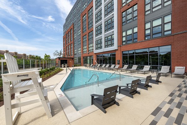 Outdoor seating and fire pit amenity at GS Platform Building 3, a luxury apartment community