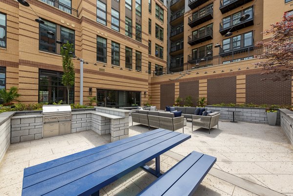 Modern fitness center with advanced equipment at GS Platform amenities, featuring spacious layout and sleek design for luxury apartment living
