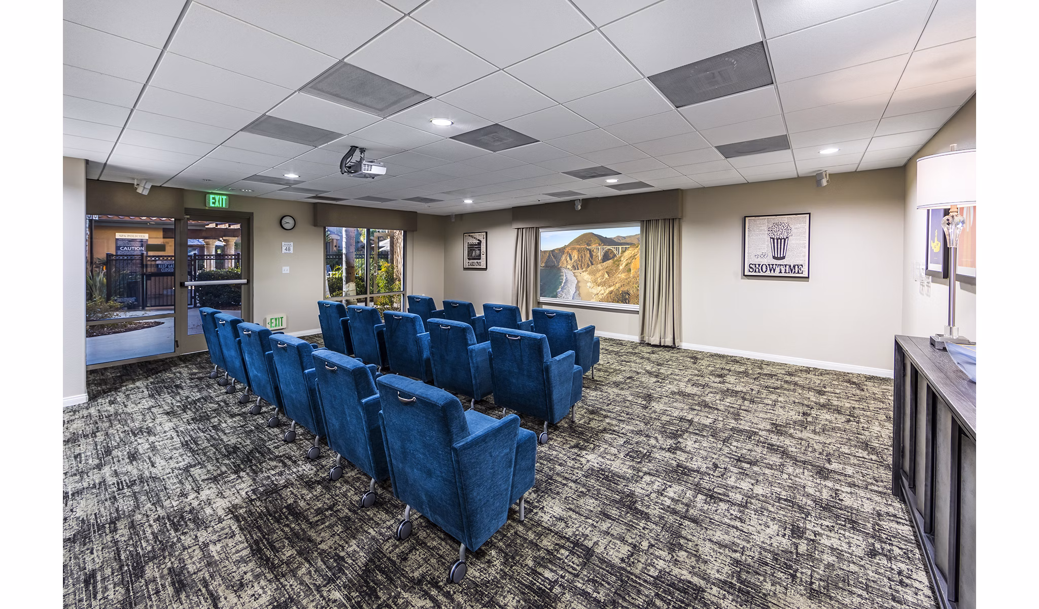 Clubhouse theater with plush seating at Overture Rancho Santa Margarita Active Adult Apartments