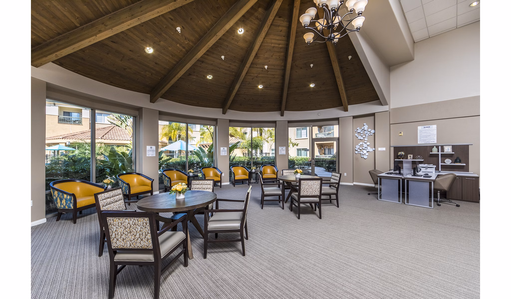 Clubhouse and leasing office at Overture Rancho Santa Margarita featuring vibrant interiors for active adults